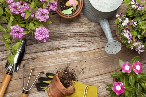 Gardener clearing a small urban garden